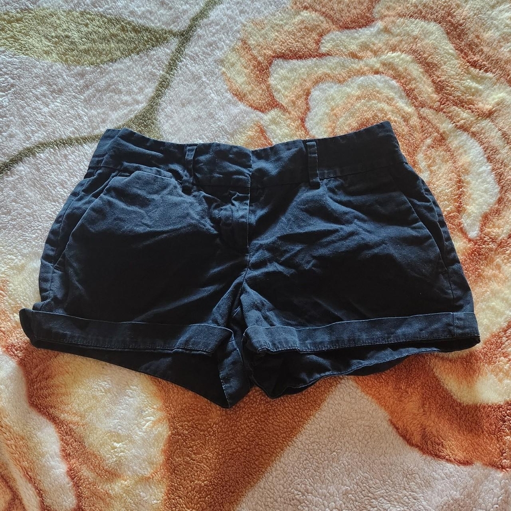black short shorts with light pink lining on the inside